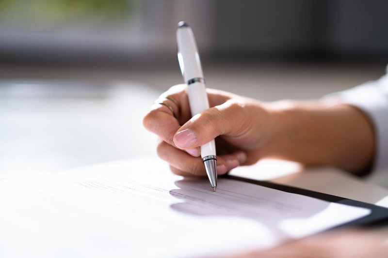 Lawyer Signing Business Contract Paper Document With Pen